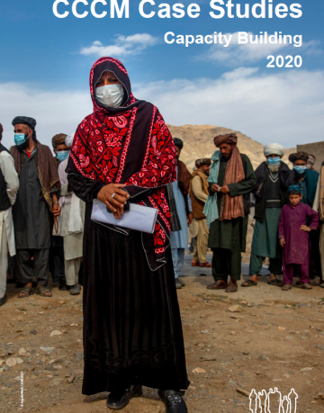 women leader in front of the other community leaders, taken in Afghanistan