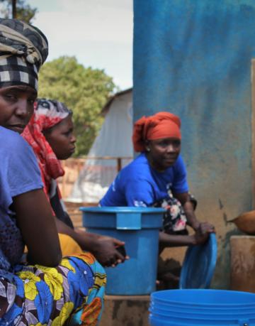 Mozambique. Internally displaced women in Cabo Delgado collecting water.